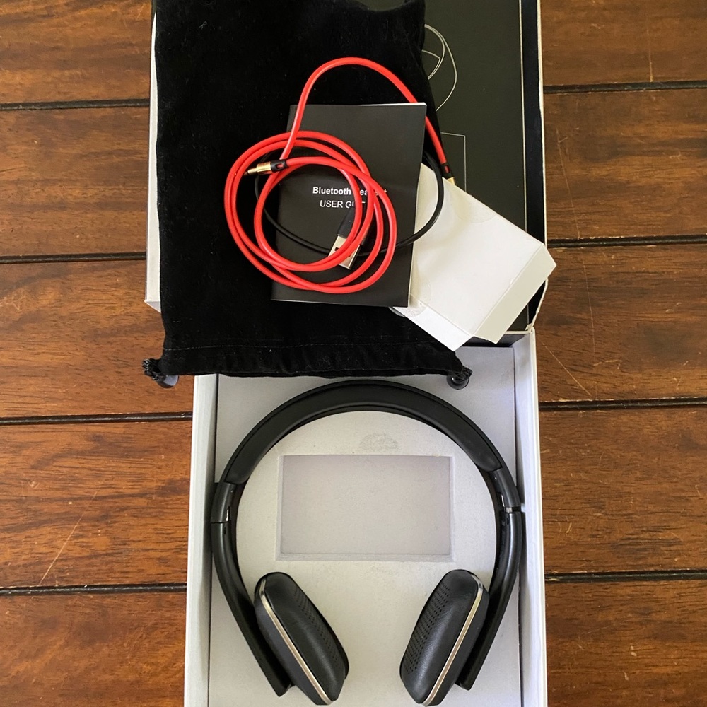 New RLX Bluetooth headphones, used 5 times. Everything is still with the box.